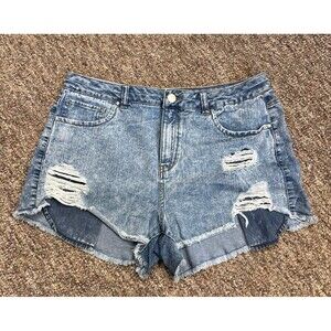 Distressed denim cutoffs with frayed hems and ripped details size 12